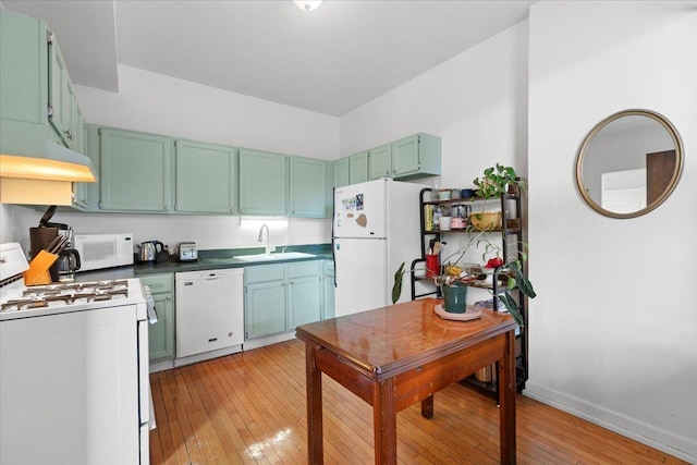 1023 N Hoyne Ave Unit 3B, Chicago, IL 60622 - kitchen with white appliances, light wood-type flooring, and under cabinet range hood