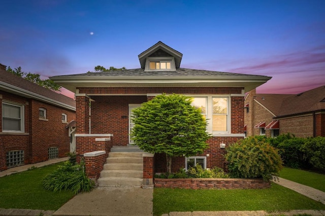 8521 S Loomis Blvd, Chicago, IL 60620 - bungalow-style home with brick siding, a lawn, and a porch