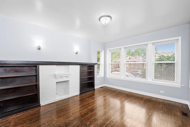 8521 S Loomis Blvd, Chicago, IL 60620 - unfurnished living room with dark wood-type flooring and a fireplace