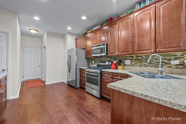 392 S Jade Ln, Round Lake, IL 60073 - kitchen with appliances with stainless steel finishes, dark wood-style flooring, backsplash, and recessed lighting