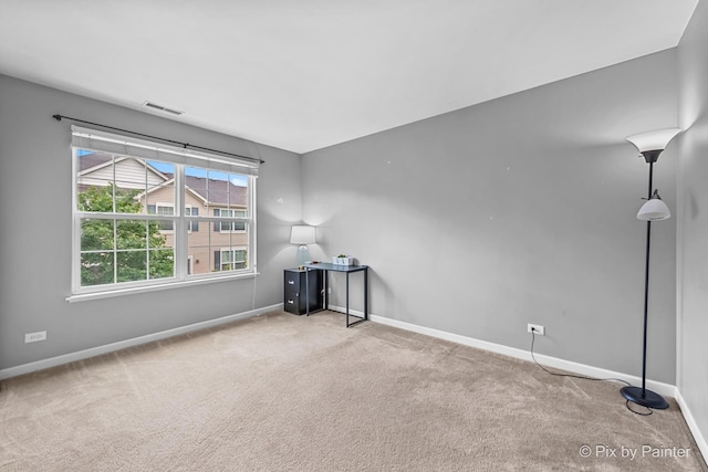 392 S Jade Ln, Round Lake, IL 60073 - carpeted empty room with baseboards