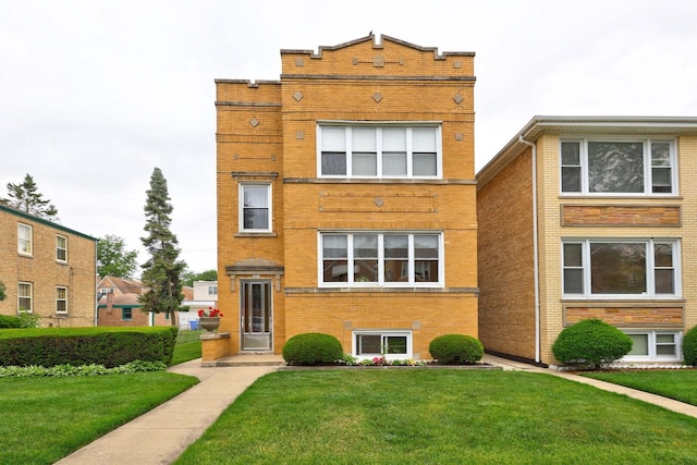 4934 N Marmora Ave, Chicago, IL 60630 - view of front of property featuring brick siding and a front yard