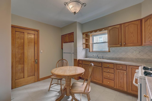 4934 N Marmora Ave, Chicago, IL 60630 - kitchen featuring white appliances, brown cabinetry, decorative backsplash, and light countertops