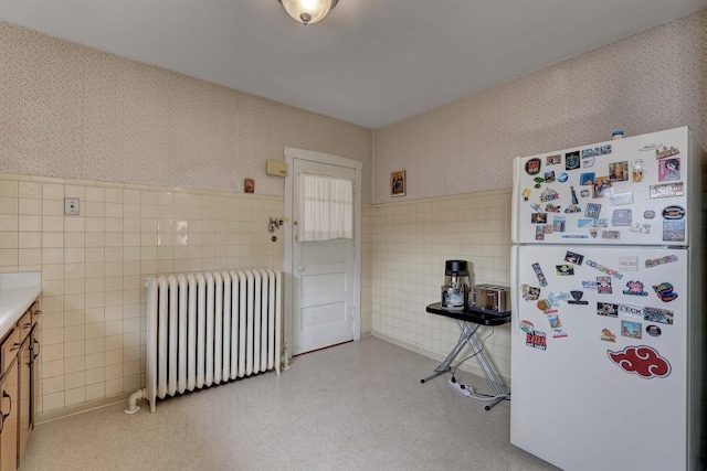 4934 N Marmora Ave, Chicago, IL 60630 - misc room featuring radiator heating unit, tile walls, wallpapered walls, and a wainscoted wall