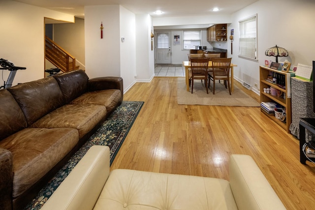 1065 Irwin Ave, Des Plaines, IL 60018 - living room featuring light wood-style flooring and stairway