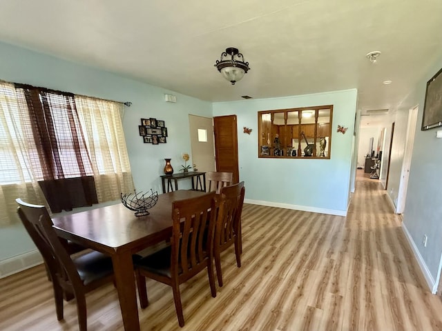 2524 Gilboa Ave, Zion, IL 60099 - dining room with light wood-style flooring and baseboards