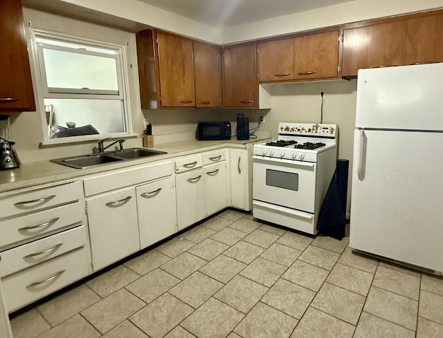 2524 Gilboa Ave, Zion, IL 60099 - kitchen with white appliances, light countertops, and white cabinets