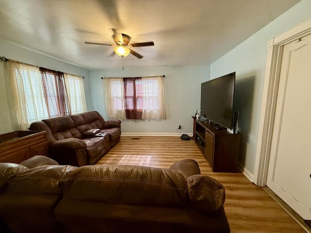 2524 Gilboa Ave, Zion, IL 60099 - living area with a ceiling fan and light wood-style floors