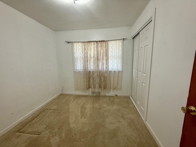 2524 Gilboa Ave, Zion, IL 60099 - unfurnished bedroom featuring carpet and a closet