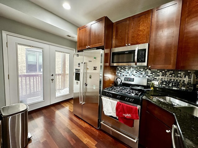 1366 W Greenleaf Ave Unit 3N, Chicago, IL 60626 - kitchen featuring appliances with stainless steel finishes, dark wood finished floors, french doors, and tasteful backsplash
