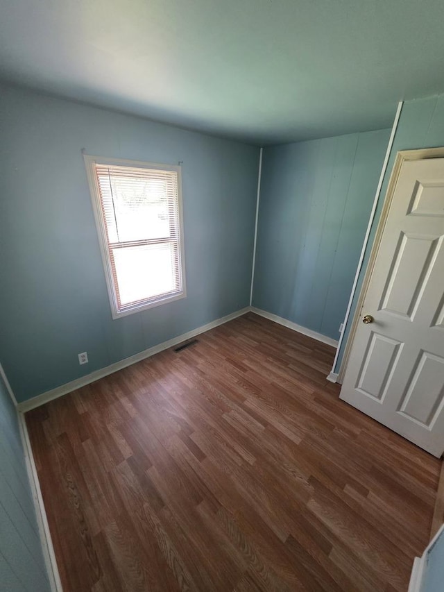 112 Sweetbriar Ct, South Elgin, IL 60177 - unfurnished bedroom with dark wood-style flooring and baseboards