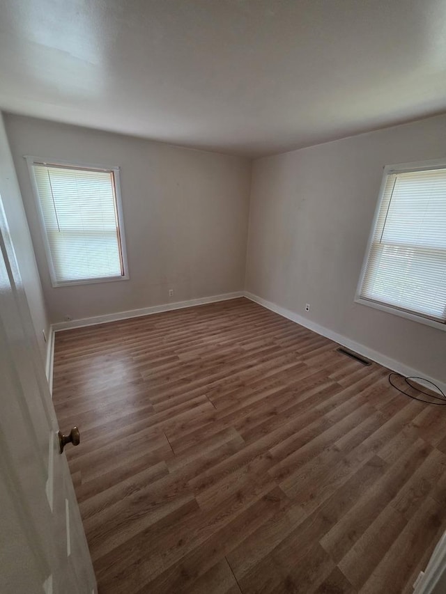 112 Sweetbriar Ct, South Elgin, IL 60177 - unfurnished room with healthy amount of natural light and wood finished floors
