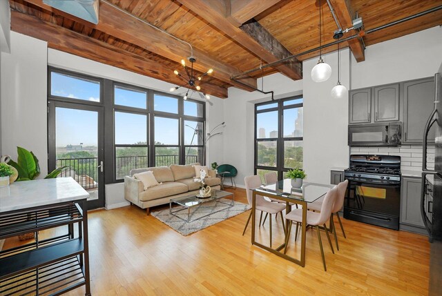 1503 S State St Unit 501, Chicago, IL 60605 - living room featuring a wooden ceiling with exposed beams, light wood-style flooring, and a chandelier