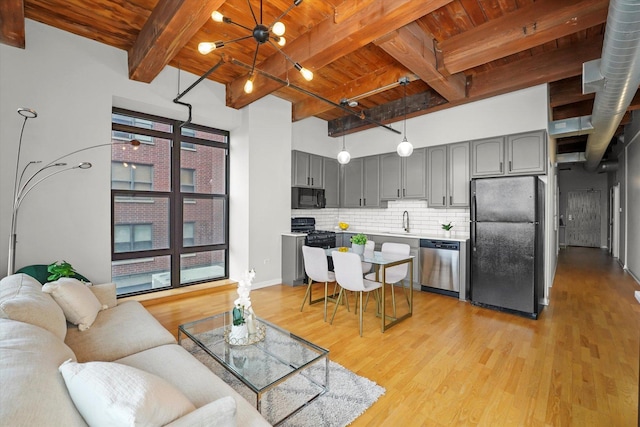 1503 S State St Unit 501, Chicago, IL 60605 - living area featuring a wood ceiling with exposed beams and light wood-style floors