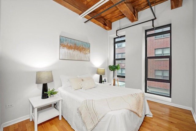 1503 S State St Unit 501, Chicago, IL 60605 - bedroom featuring wood finished floors and a wood ceiling with exposed beams