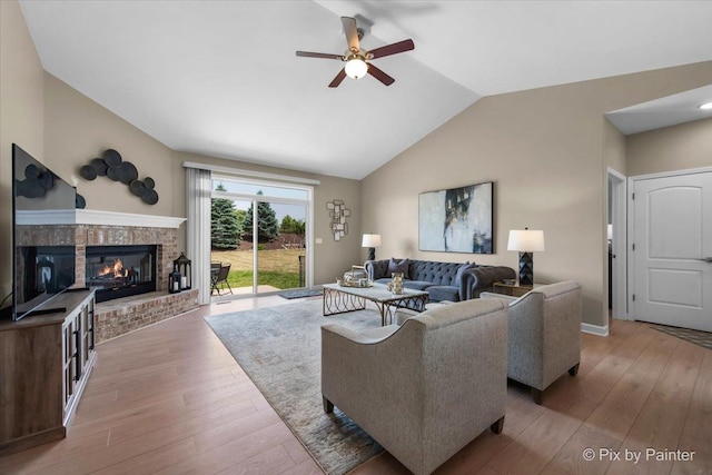 2213 Tyler Trl, Mchenry, IL 60051 - living area with vaulted ceiling, ceiling fan, hardwood / wood-style flooring, and a brick fireplace