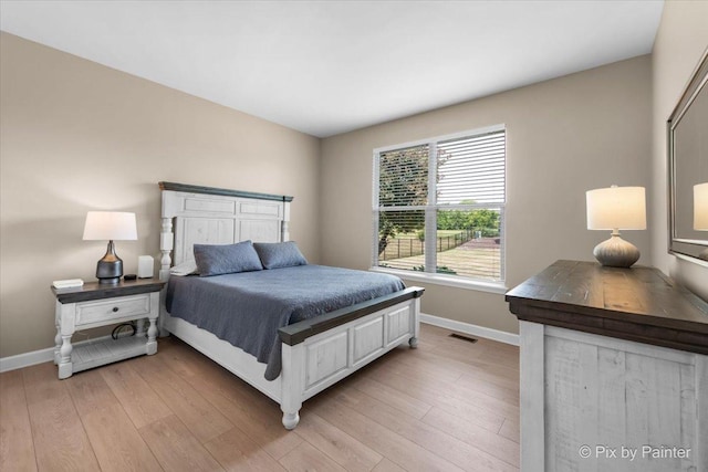 2213 Tyler Trl, Mchenry, IL 60051 - bedroom featuring baseboards and light wood-type flooring