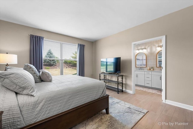 2213 Tyler Trl, Mchenry, IL 60051 - bedroom with light wood-style floors and connected bathroom