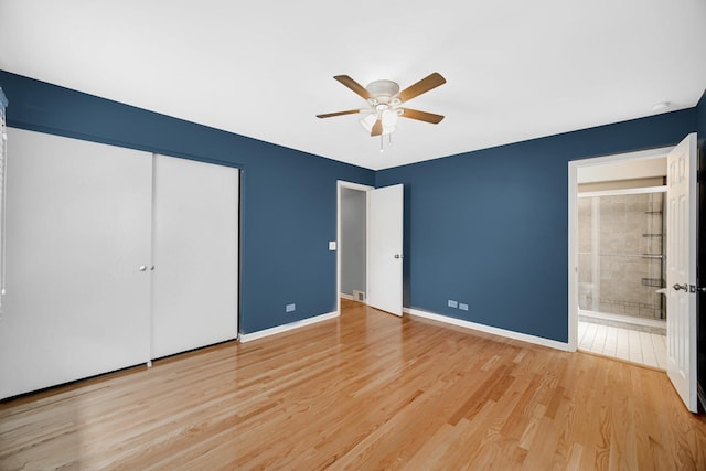 220 N Yates Ln, Mount Prospect, IL 60056 - unfurnished bedroom featuring light wood finished floors, a closet, ensuite bathroom, and ceiling fan