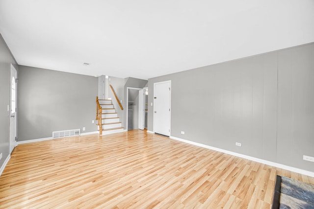 220 N Yates Ln, Mount Prospect, IL 60056 - unfurnished living room featuring stairway and wood finished floors