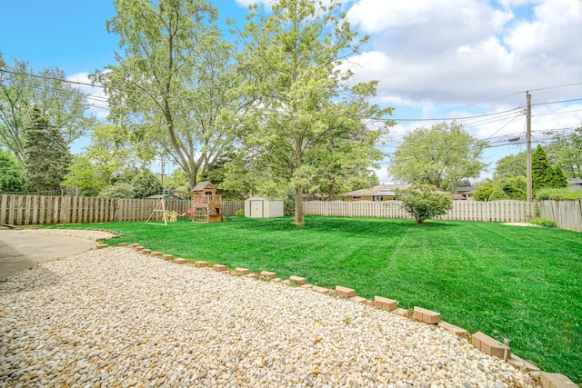 220 N Yates Ln, Mount Prospect, IL 60056 - fenced backyard featuring a storage unit and a playground