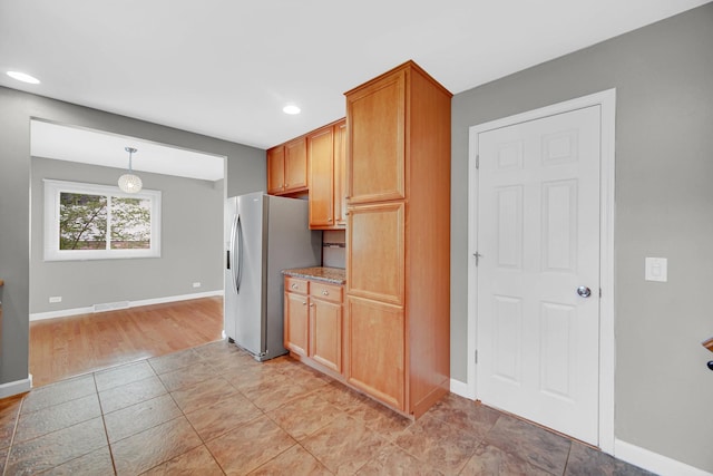 220 N Yates Ln, Mount Prospect, IL 60056 - kitchen featuring stainless steel fridge with ice dispenser, recessed lighting, hanging light fixtures, and light tile patterned floors