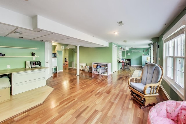 34113 N Primrose Ct, Round Lake, IL 60073 - living area featuring light wood-style flooring and decorative columns