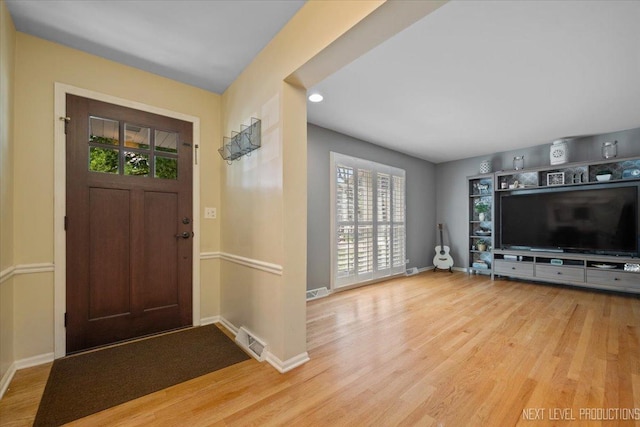 1009 E Bailey Rd, Naperville, IL 60565 - entrance foyer with wood finished floors, healthy amount of natural light, and recessed lighting