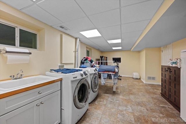 1009 E Bailey Rd, Naperville, IL 60565 - washroom with washing machine and clothes dryer, cabinet space, and light stone finish floors