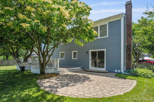 1009 E Bailey Rd, Naperville, IL 60565 - rear view of house with a chimney, a patio area, and a deck