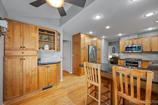 1009 E Bailey Rd, Naperville, IL 60565 - kitchen featuring appliances with stainless steel finishes, light wood-style flooring, tasteful backsplash, recessed lighting, and a ceiling fan
