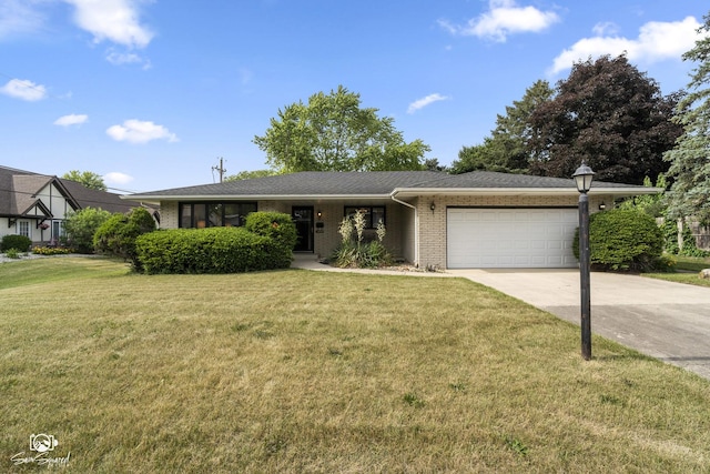 1458 Pleasant Dr, Crest Hill, IL 60403 - view of front of home with a garage, brick siding, driveway, and a front lawn