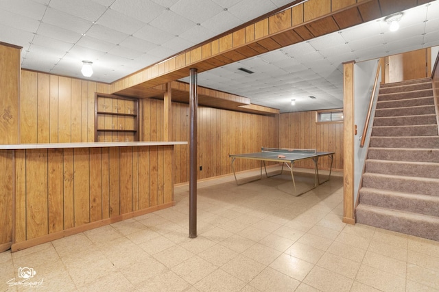 1458 Pleasant Dr, Crest Hill, IL 60403 - playroom with tile patterned floors, wood walls, a dry bar, and a paneled ceiling