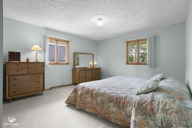 1458 Pleasant Dr, Crest Hill, IL 60403 - bedroom with carpet flooring, a textured ceiling, and a baseboard heating unit