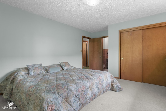 1458 Pleasant Dr, Crest Hill, IL 60403 - carpeted bedroom featuring a closet and a textured ceiling