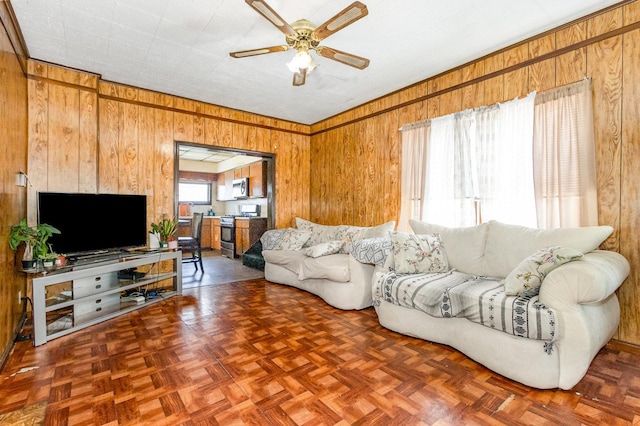 408 Summit St, Joliet, IL 60435 - living area with wood walls and a ceiling fan