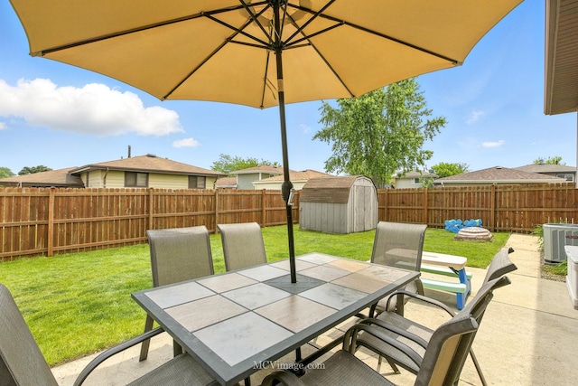 16821 89th Ave, Orland Hills, IL 60487 - fenced backyard with outdoor dining area, a shed, and a patio