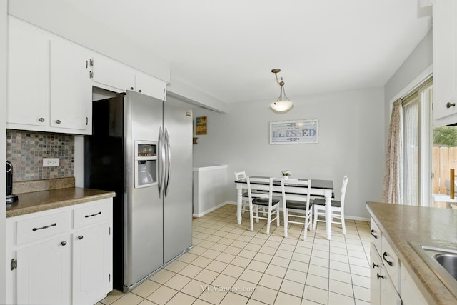 16821 89th Ave, Orland Hills, IL 60487 - kitchen featuring stainless steel fridge, backsplash, light tile patterned floors, and white cabinetry
