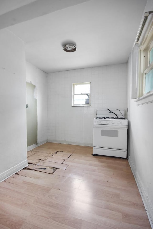 10445 S S Ave H, Chicago, IL 60617 - kitchen featuring white gas range and wood finished floors