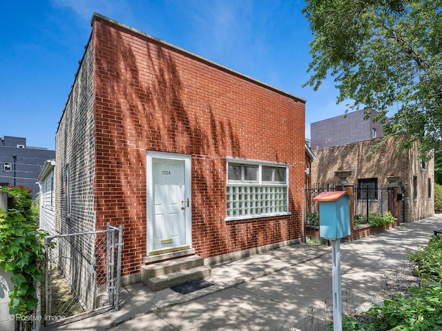 1754 W Cortland St, Chicago, IL 60622 - view of front of property with entry steps, brick siding, and a patio
