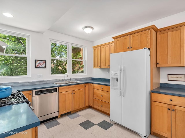 1754 W Cortland St, Chicago, IL 60622 - kitchen with white refrigerator with ice dispenser, stainless steel dishwasher, light flooring, dark countertops, and recessed lighting