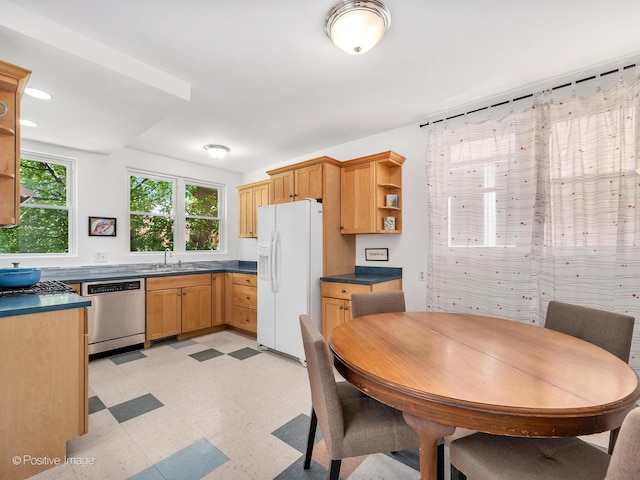 1754 W Cortland St, Chicago, IL 60622 - kitchen with appliances with stainless steel finishes, open shelves, light flooring, and dark countertops