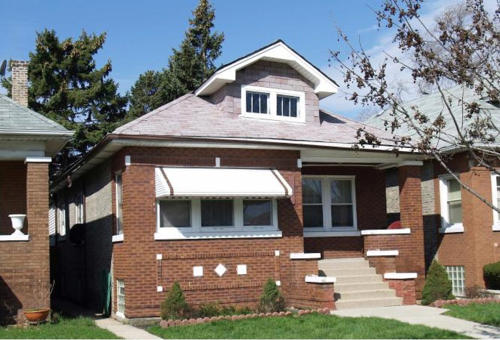 1704 N Moody Ave, Chicago, IL 60639 - bungalow-style home with brick siding
