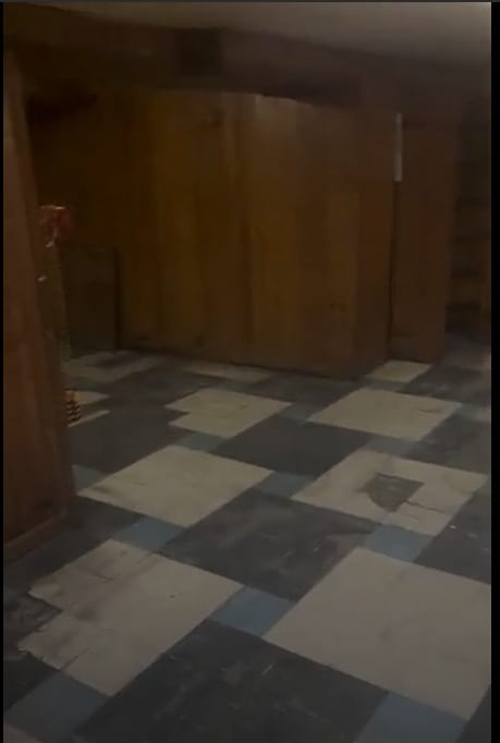 1704 N Moody Ave, Chicago, IL 60639 - corridor featuring tile patterned floors and wood walls