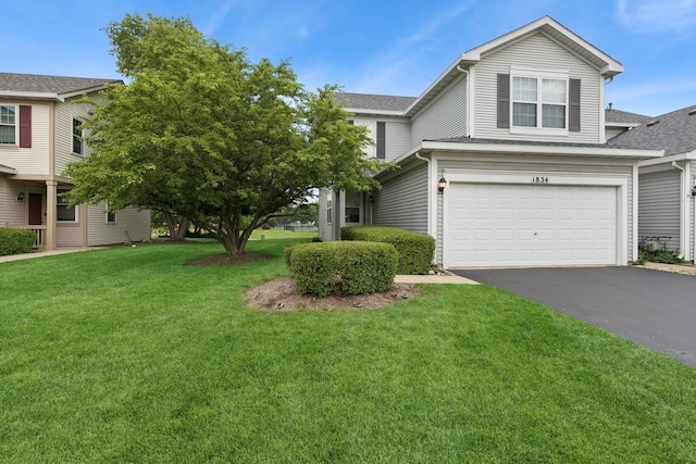 1834 N Wentworth Cir, Romeoville, IL 60446 - traditional home featuring driveway, a garage, a front yard, and roof with shingles