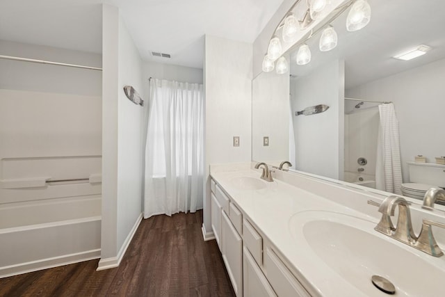 1834 N Wentworth Cir, Romeoville, IL 60446 - full bathroom featuring wood finished floors, double vanity, and shower / bath combo with shower curtain