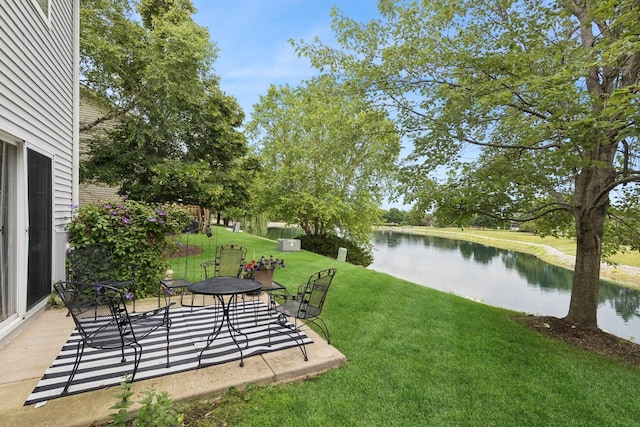 1834 N Wentworth Cir, Romeoville, IL 60446 - view of green lawn featuring a water view and a patio area