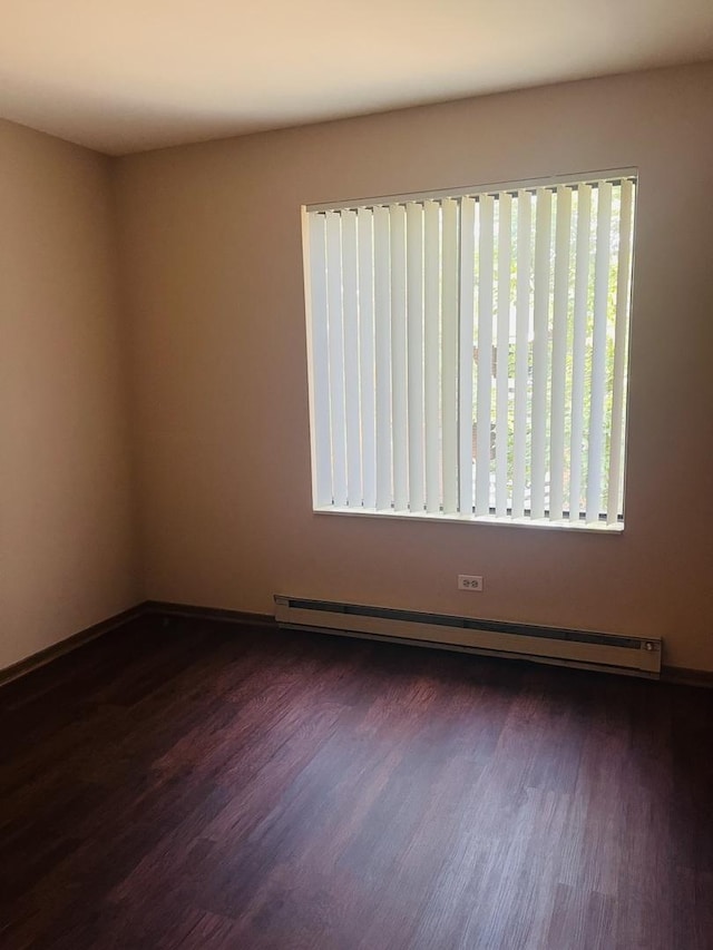 1335 N Winslowe Dr Unit 304, Palatine, IL 60074 - empty room with a baseboard radiator and dark wood finished floors