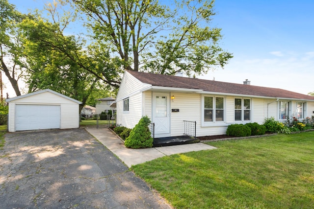 8928 S Ryan Rd, Hometown, IL 60456 - view of front facade featuring asphalt driveway, a garage, an outdoor structure, and a front yard