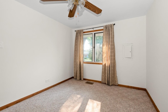 8928 S Ryan Rd, Hometown, IL 60456 - unfurnished room with electric panel, light colored carpet, and a ceiling fan